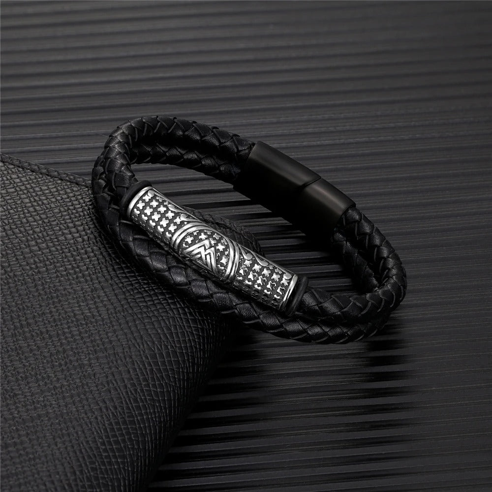 Braided black leather bracelet for men with a stamped silver-tone barrel bead and a matt black box clasp