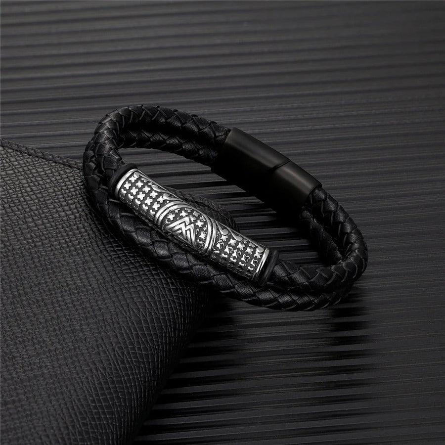 Braided black leather bracelet for men with a stamped silver-tone barrel bead and a matt black box clasp
