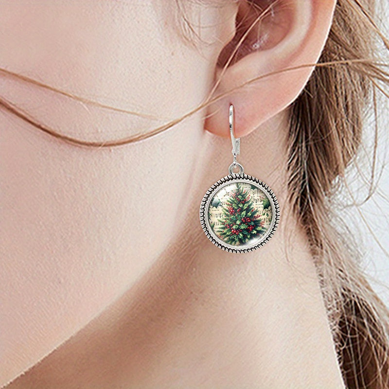 Christmas tree earring worn on the ear, showing the leverback closure