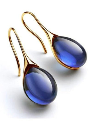 Deep blue teardrop cabochon drop earrings with gold-tone hook wires