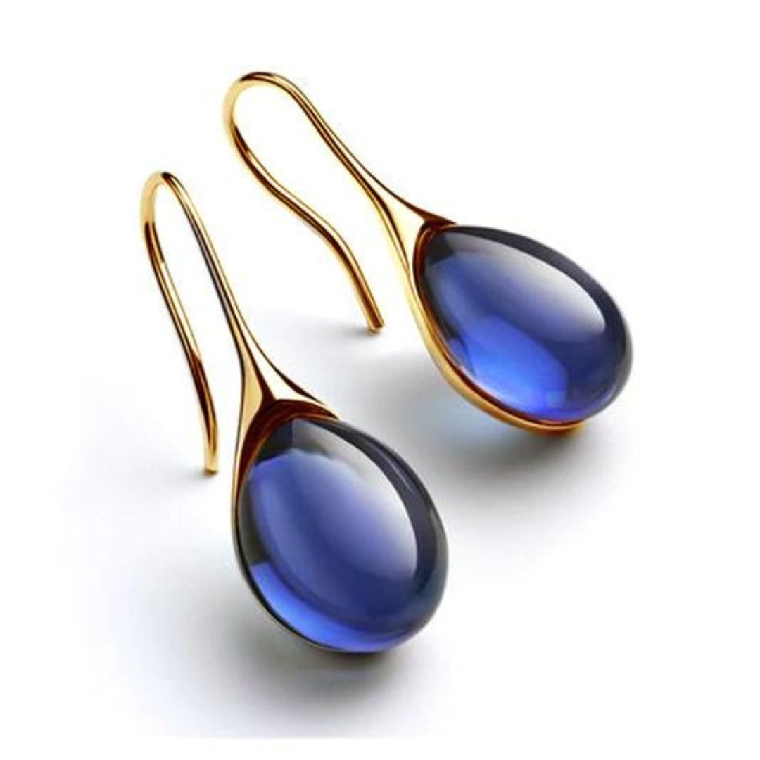 Deep blue teardrop cabochon drop earrings with gold-tone hook wires