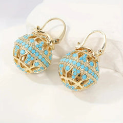 Gold-tone filigree globe drop earrings set with turquoise-effect stones