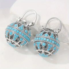 Gold-tone filigree globe drop earrings set with turquoise-effect stones