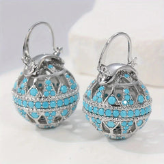 Gold-tone filigree globe drop earrings set with turquoise-effect stones