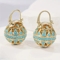 Gold-tone filigree globe drop earrings set with turquoise-effect stones