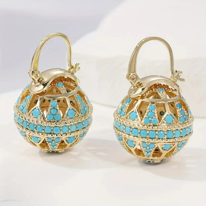 Gold-tone filigree globe drop earrings set with turquoise-effect stones
