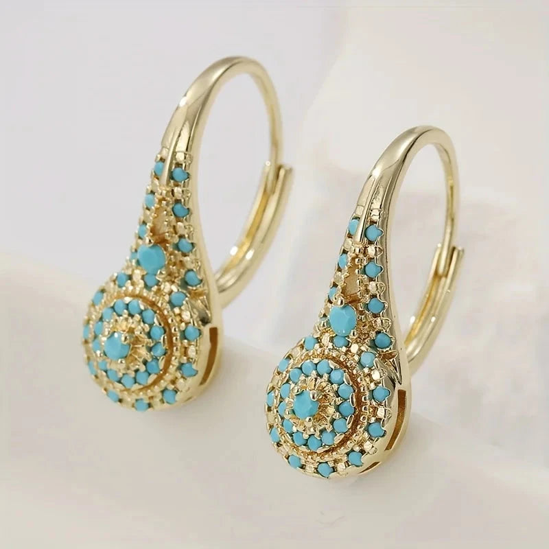 Gold-tone teardrop drop earrings with a turquoise-effect stone mosaic