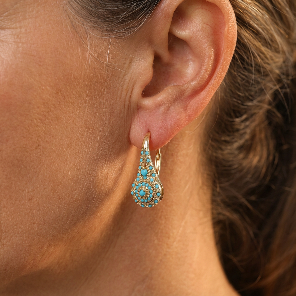 Gold-tone teardrop drop earrings with a turquoise-effect stone mosaic