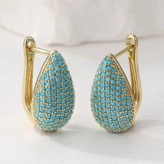 Gold-tone teardrop huggie earrings pave set with turquoise-effect stones
