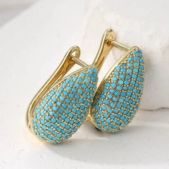 Gold-tone teardrop huggie earrings pave set with turquoise-effect stones