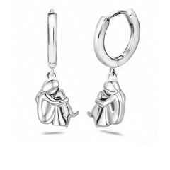 Matching huggie earrings of the same figure and dog in an all silver-tone finish