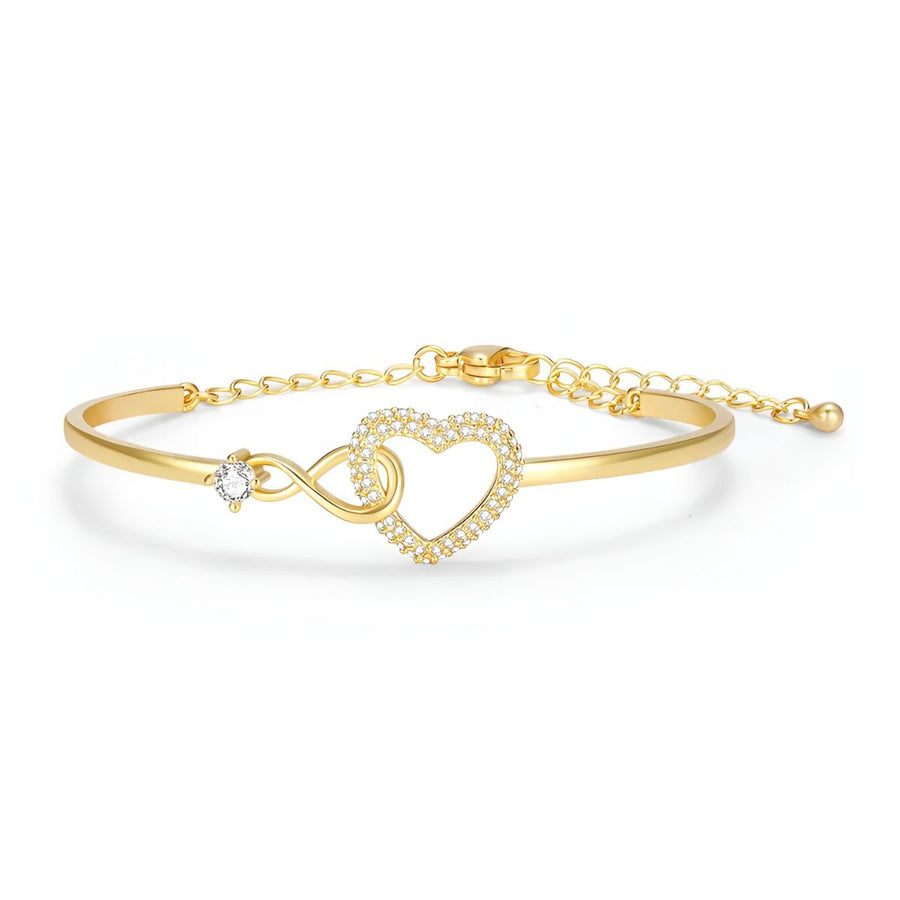 Mother daughter bracelet in yellow gold tone, a slim bangle closing through an open pave-set heart