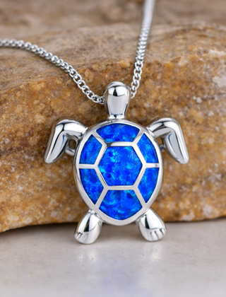 Opal turtle pendant necklace with a blue shell on a fine chain