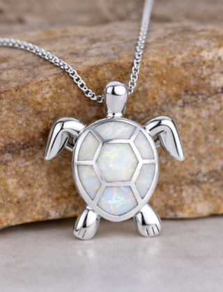 Opal turtle pendant necklace with a white shell