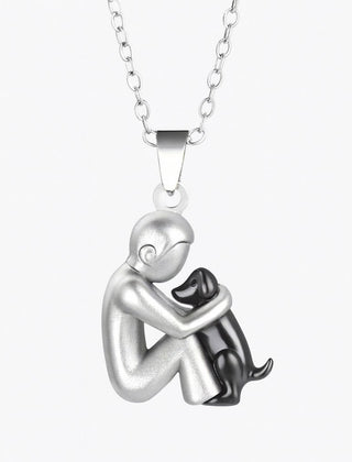 Pendant necklace of a short-haired figure hugging a black-finished dog