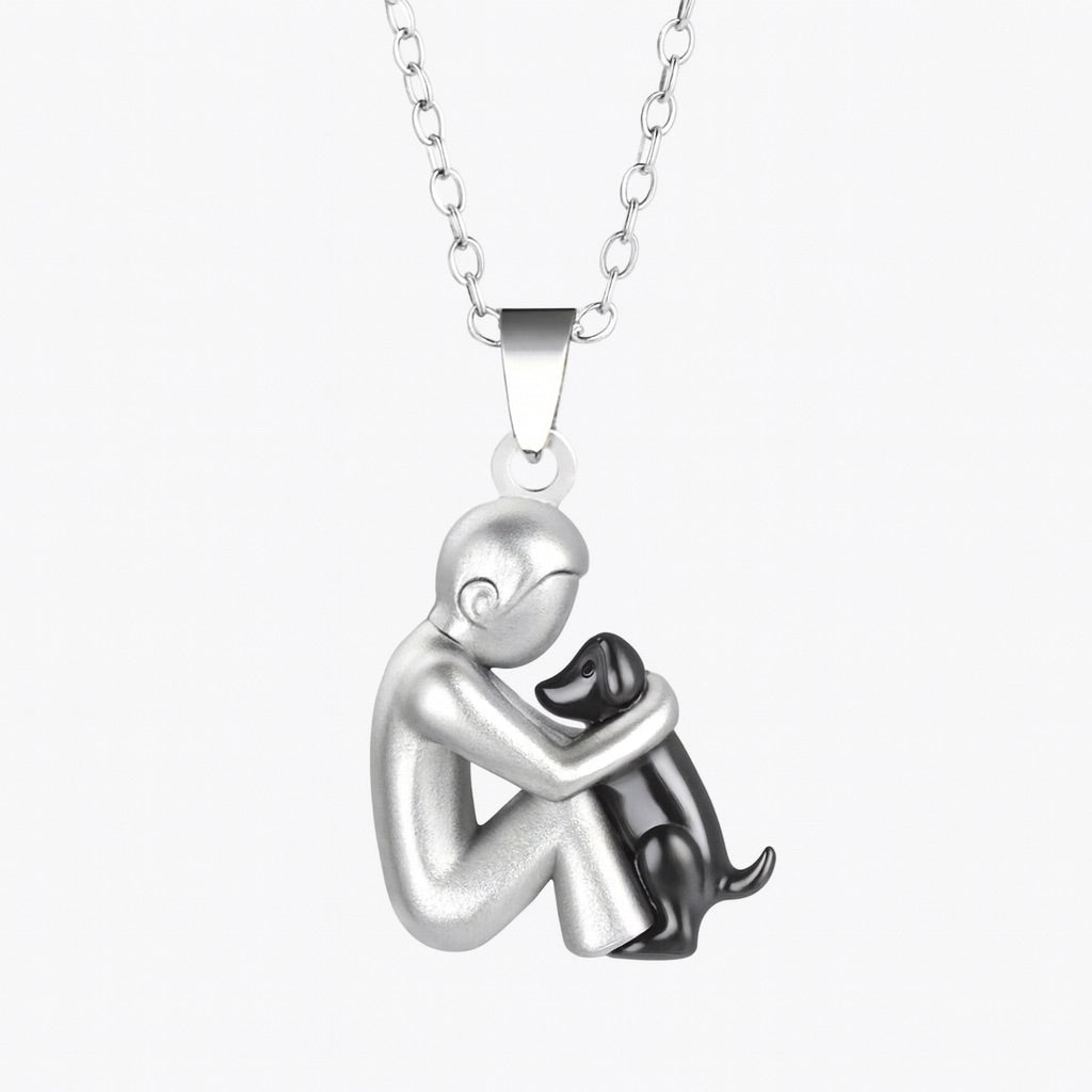 Pendant necklace of a short-haired figure hugging a black-finished dog