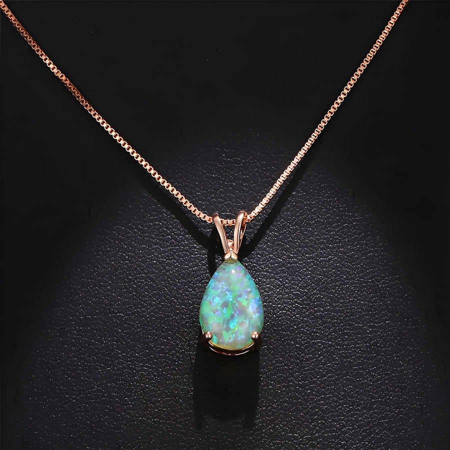 Rose gold-tone opal necklace with a pale sea-green pear-shaped stone in a four-claw setting on a fine box chain