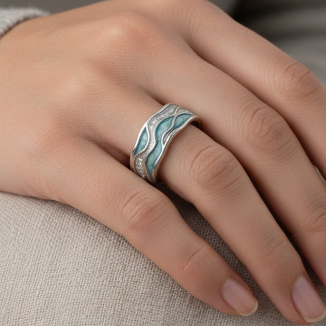 Silver-tone band ring with a turquoise and blue wave inlay