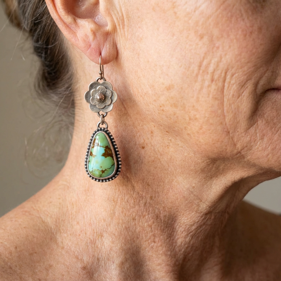 Silver-tone rose drop earrings with a large veined turquoise-effect teardrop