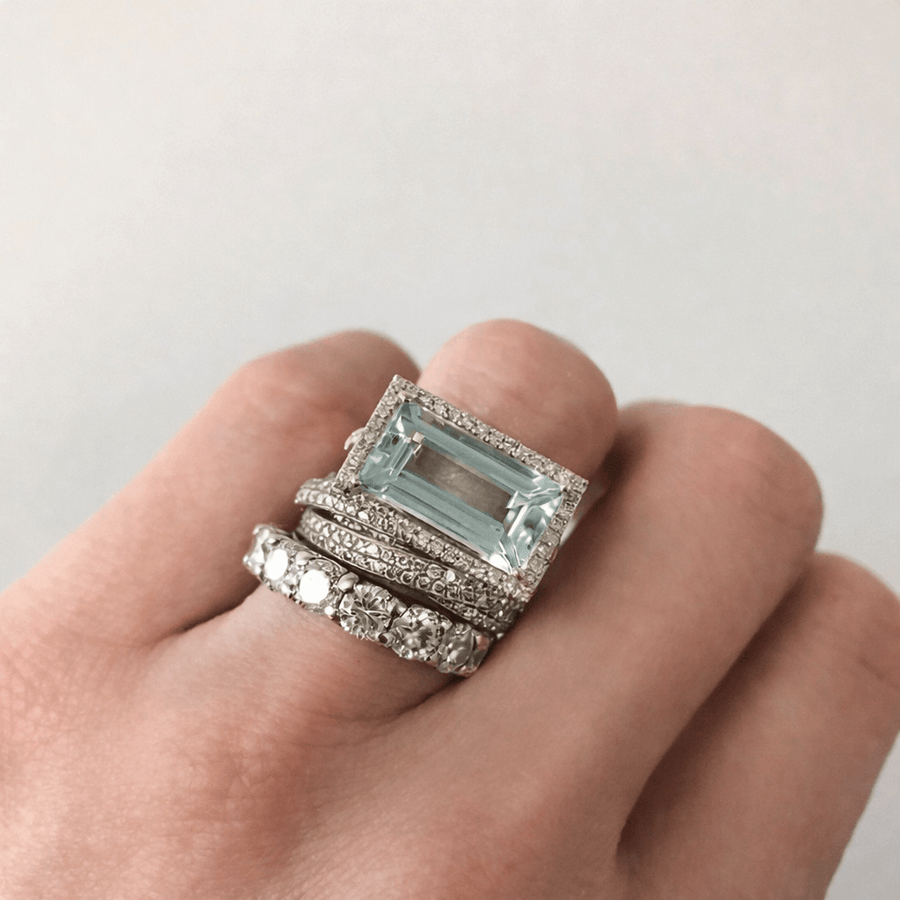 Silver-tone three-band stacking ring set with a rectangular aqua stone