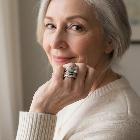 Silver-tone three-band stacking ring set with a rectangular aqua stone