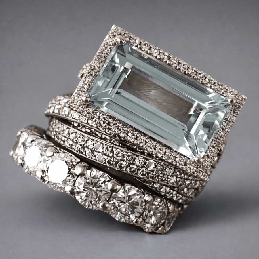 Silver-tone three-band stacking ring set with a rectangular aqua stone