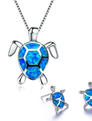 Silver-tone turtle necklace with a blue inlaid opal shell and matching stud earrings