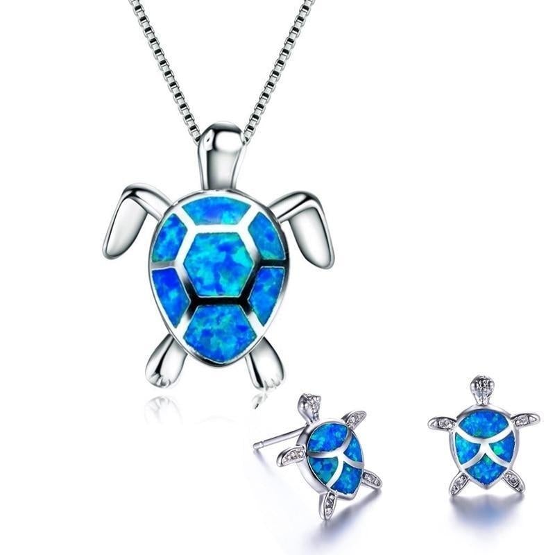 Silver-tone turtle necklace with a blue inlaid opal shell and matching stud earrings