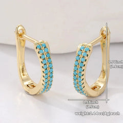 Slim gold-tone huggie hoop earrings with two rows of turquoise-effect pave