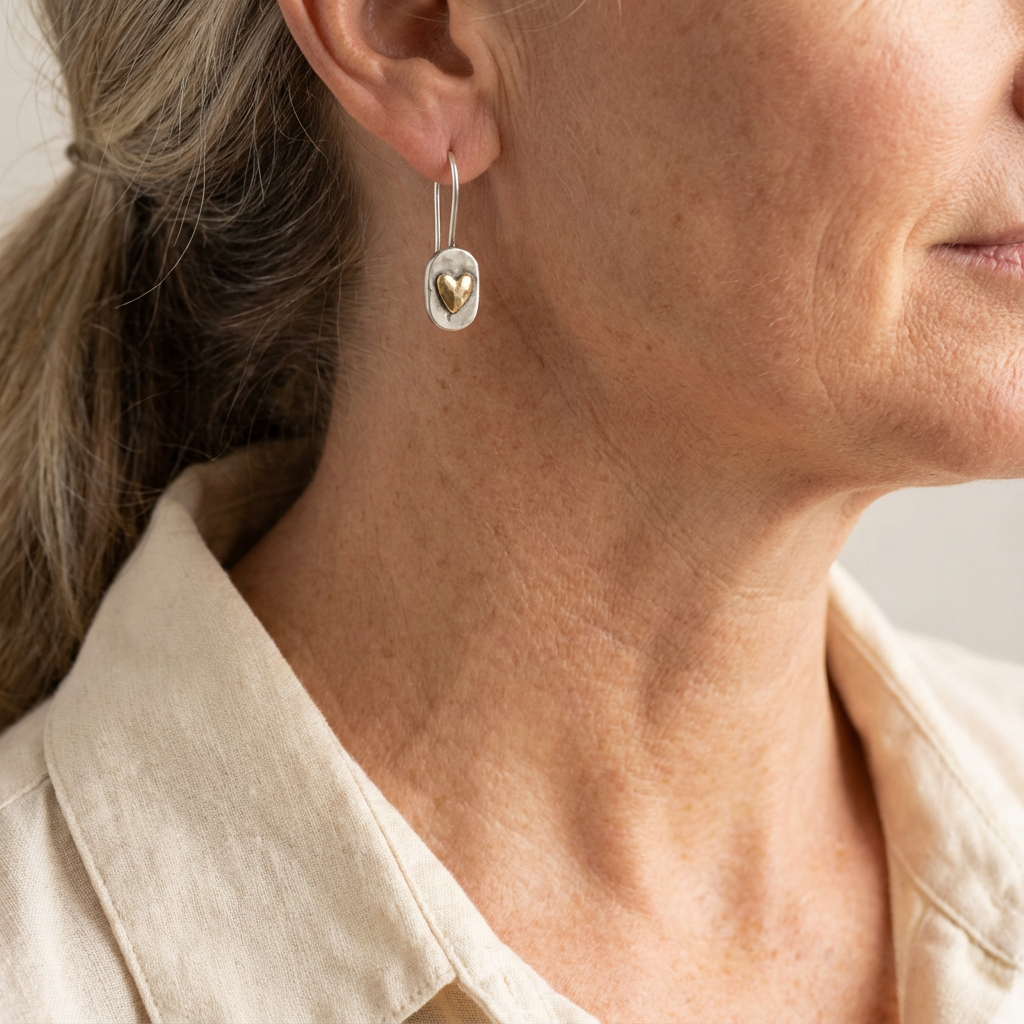 Small polished two-tone dome drop earrings on a fine hook