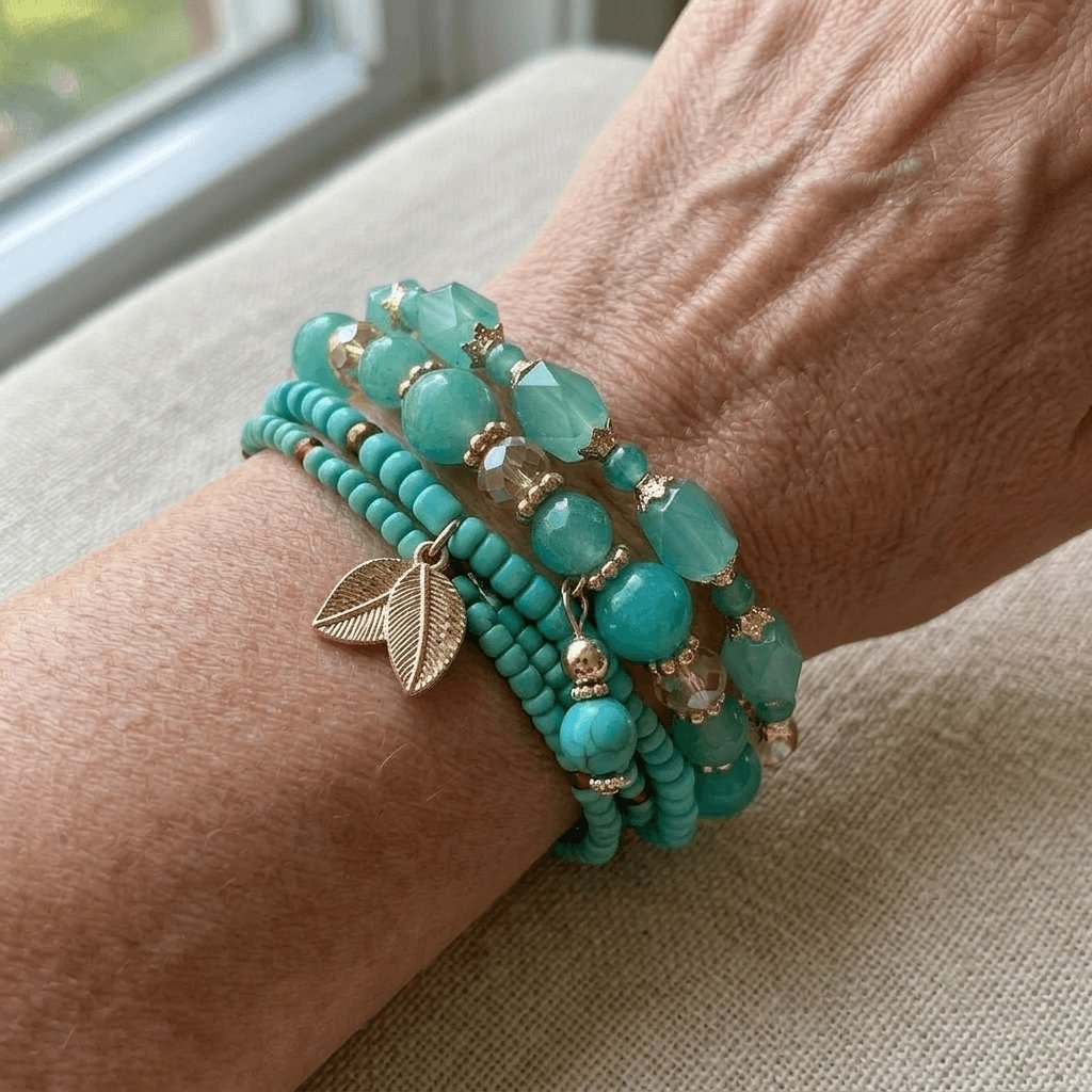 Stack of four turquoise and green beaded stretch bracelets