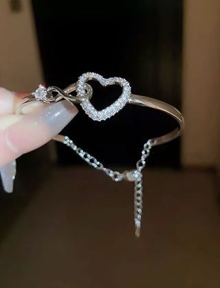 The same bangle in white gold tone, showing the extension chain at the back