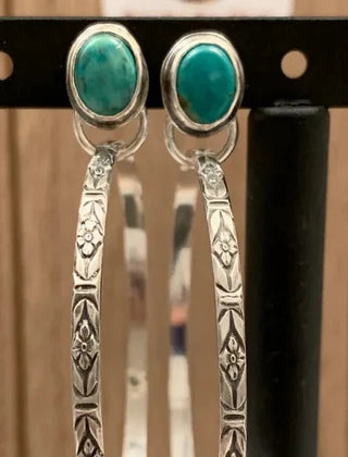 The same stamped hoop earrings with green-teal oval stones