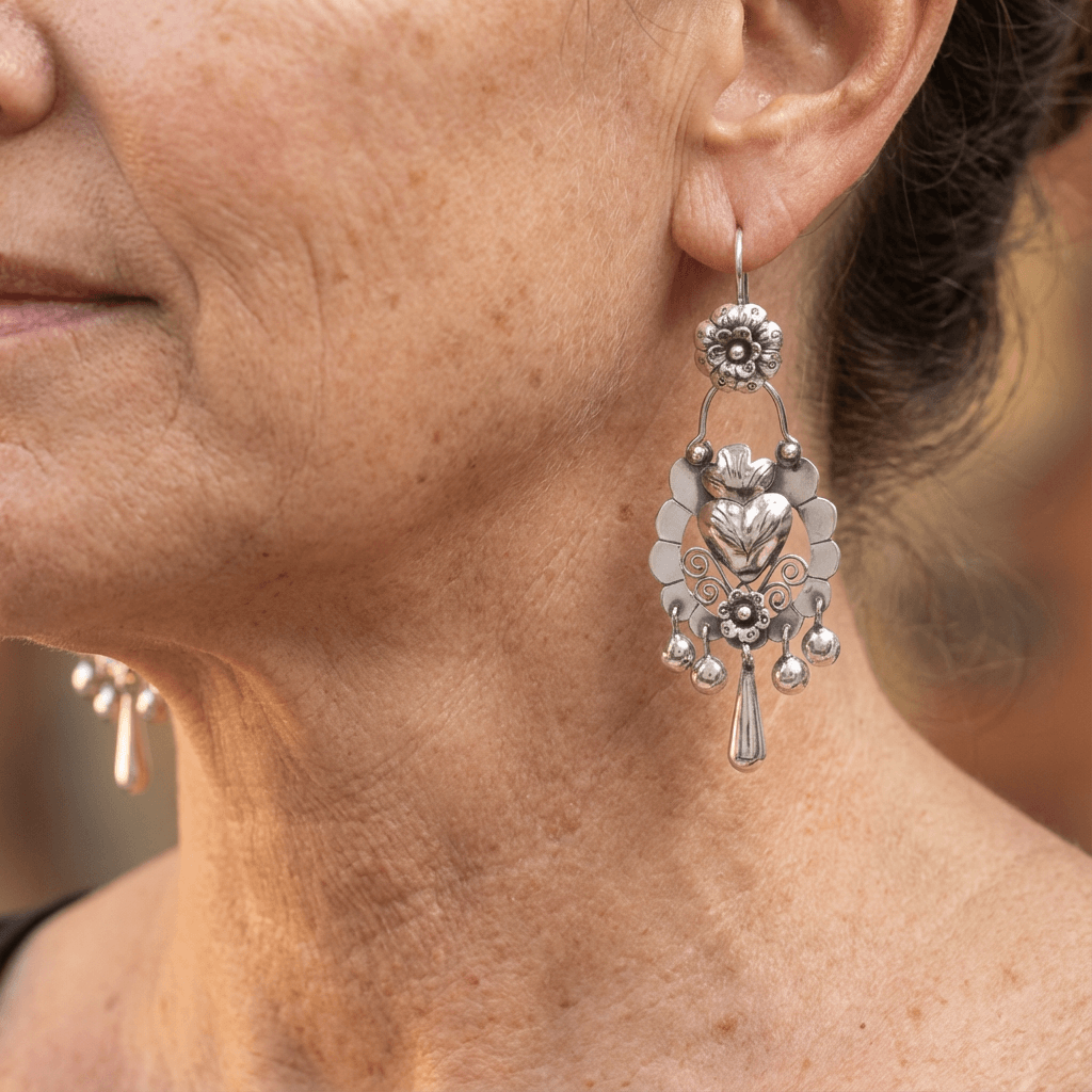 Tiered silver-tone chandelier drop earrings with a heart centre
