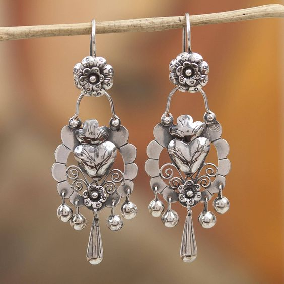 Tiered silver-tone chandelier drop earrings with a heart centre