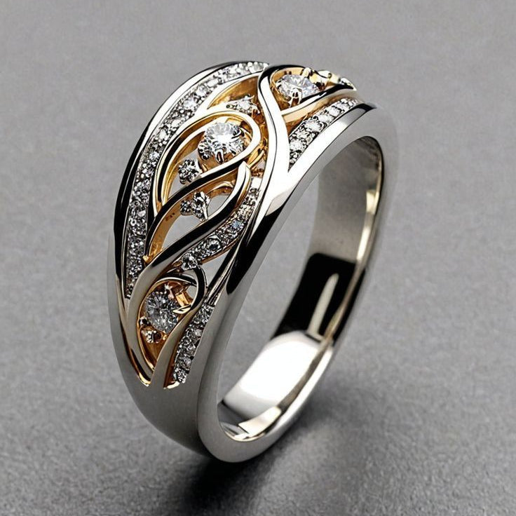 Two-tone openwork ring with a cut-out vine pattern and gold-tone leaves